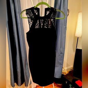 Express size 4 little black dress with lace detailing. New with tags.